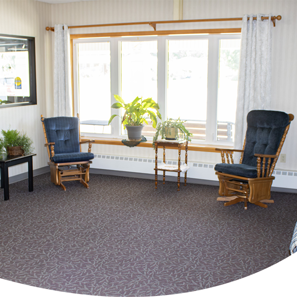 Bright and welcoming assisted living community at Stonebridge Suites of Cherokee with comfortable seating and natural light